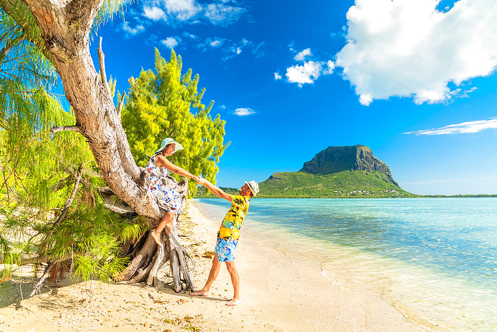 Playful man and woman in love having fun on tropical beach, Ile aux Benitiers, La Gaulette, Le Morne, Mauritius, Indian Ocean, Africa