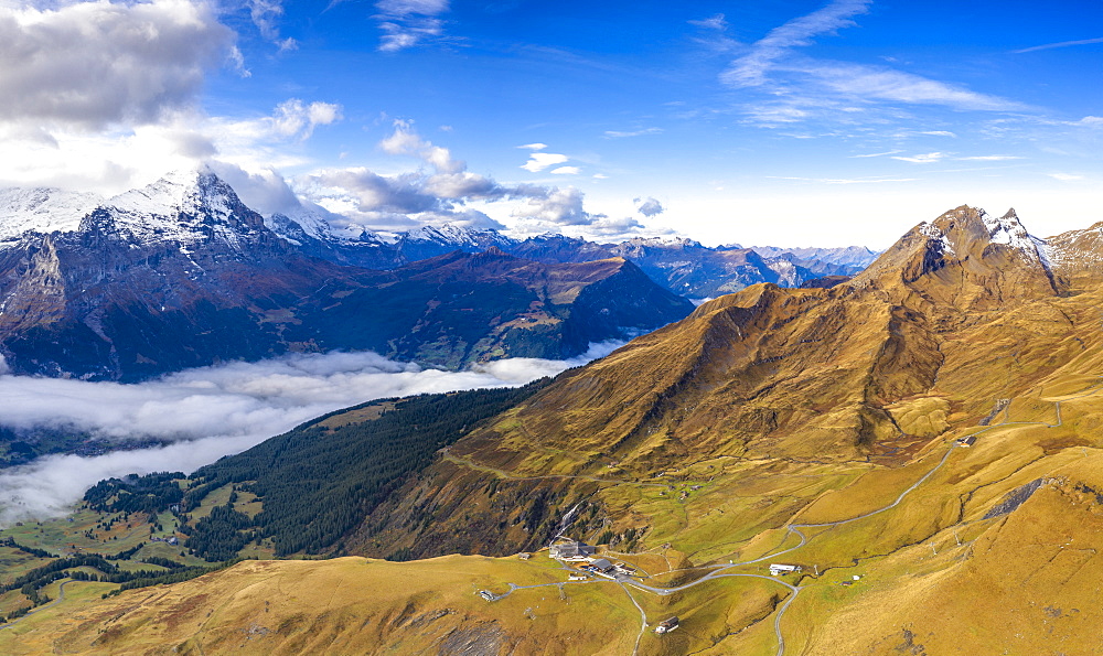 Aerial panoramic of Eiger and sea of clouds surrounding First and Grindelwald in autumn, Bernese Alps, Canton of Bern, Switzerland, Europe