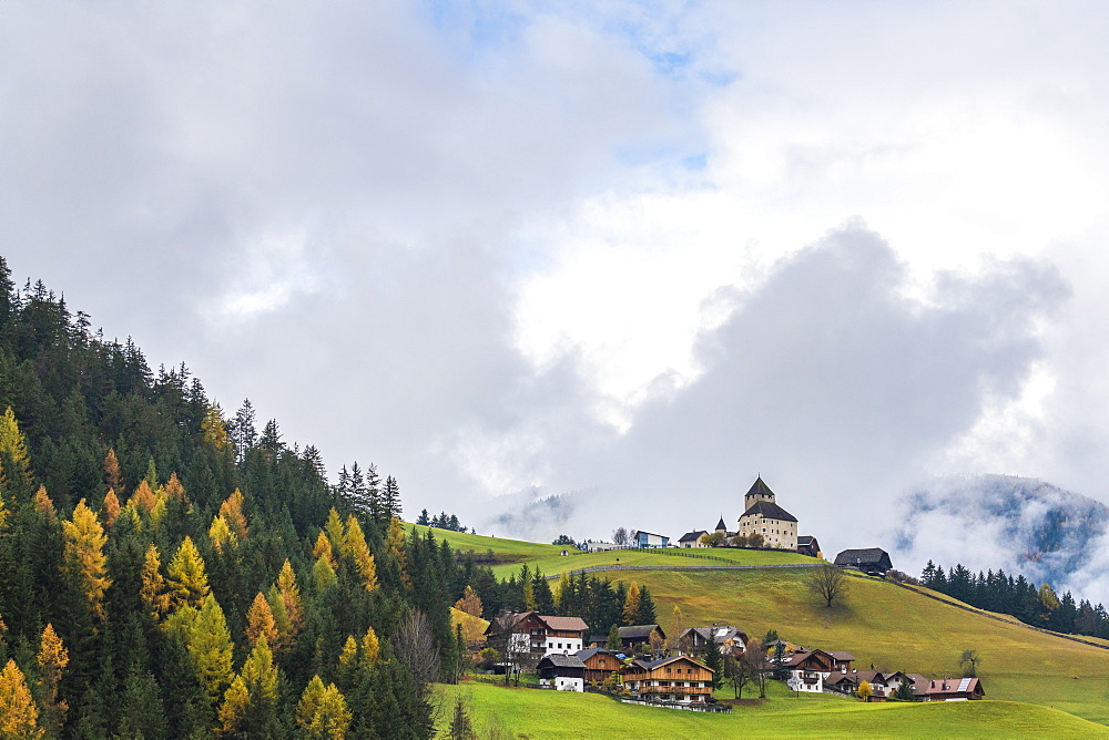 Ciastel de Tor surrounded by woods in autumn, San Martino in Badia, Val Badia, Dolomites, South Tyrol, Italy, Europe