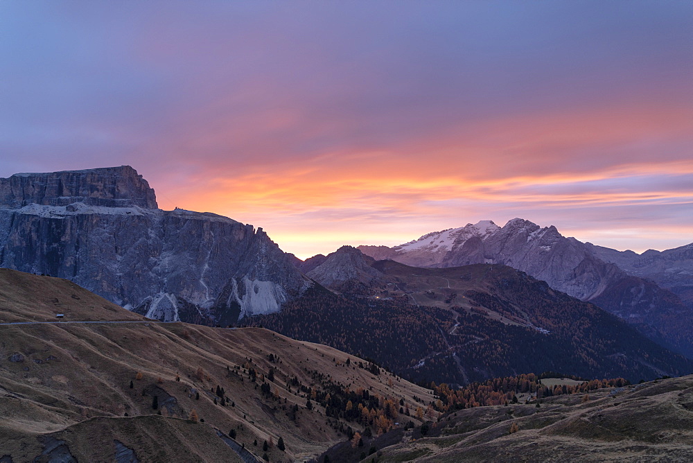 Autumn sunrise over Marmolada and Sass Pordoi from Passo Sella, Val Gardena, Dolomites, South Tyrol, Trentino-Alto Adige, Italy, Europe