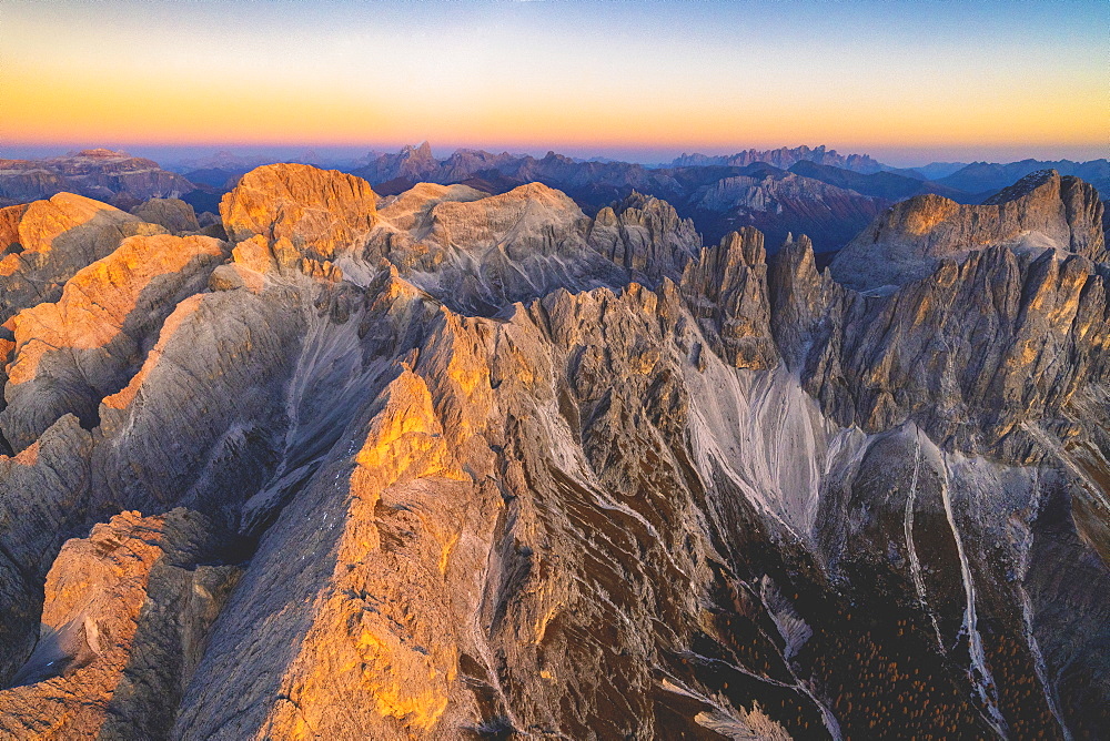 Aerial view of Torri Del Vajolet and Catinaccio Group lit by the autumn sunset, Dolomites, South Tyrol, Italy, Europe