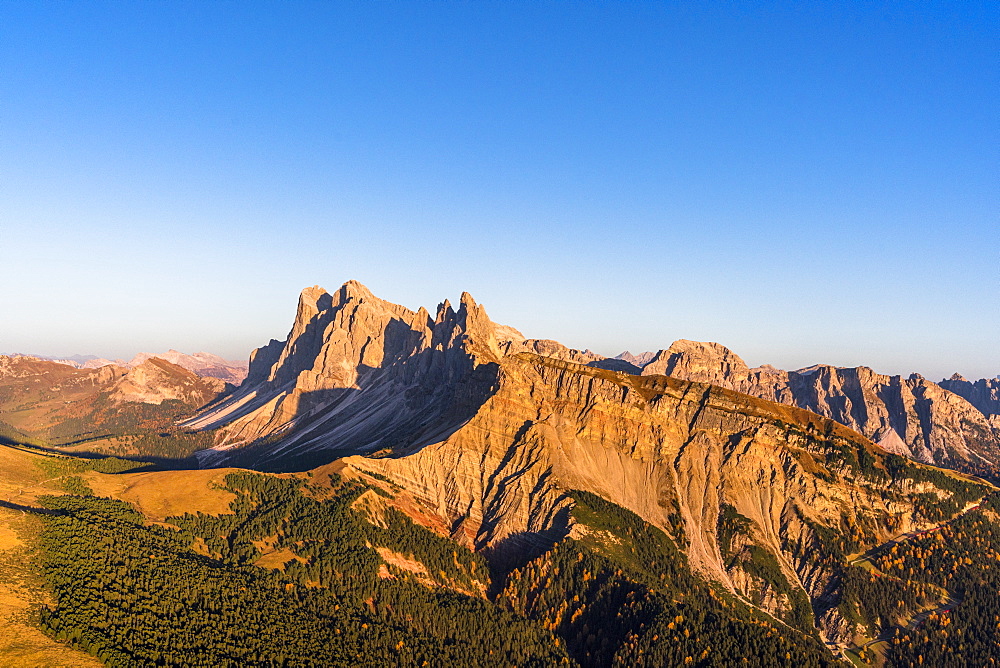 Aerial view of sunset over Seceda mountain in autumn, Cisles-Odle Nature Park, Dolomites, Val Gardena, South Tyrol, Italy, Europe