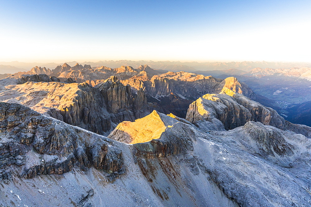 Aerial view of sunset over Sella Group and Odle mountain range in autumn, Val Gardena, Val Funes, Dolomites, South Tyrol, Italy, Europe