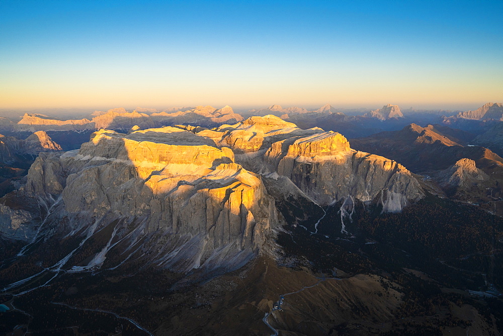 Aerial view of sunset over Sella Group and Sass Pordoi in autumn, Val Gardena, Val di Fassa, Dolomites, South Tyrol, Italy, Europe