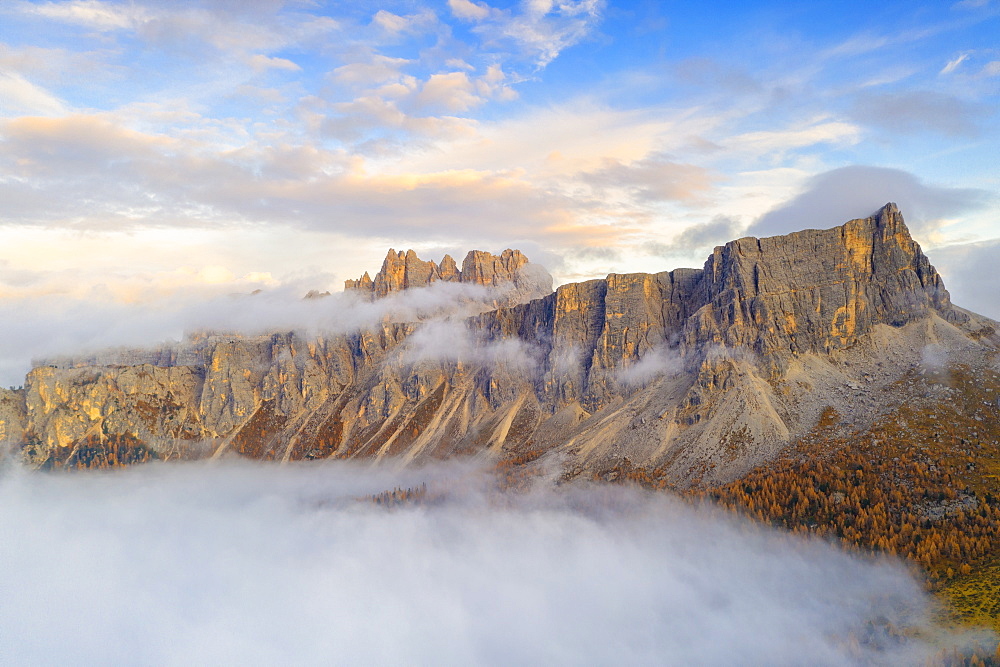 Aerial view by drone of mist at sunset over Lastoi De Formin and Cima Ambrizzola in autumn, Giau Pass, Dolomites, Belluno, Veneto, Italy, Europe