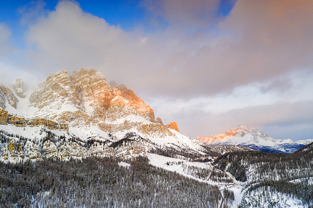 Sunrise over Monte Cristallo and Passo Tre Croci surrounded by snowy woods, Dolomites, Belluno province, Veneto, Italy, Europe