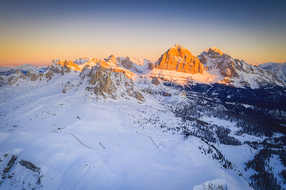 View by drone of Giau Pass, Ra Gusela, Nuvolau, Averau and Tofane at sunrise in winter, Dolomites, Belluno province, Veneto, Italy, Europe