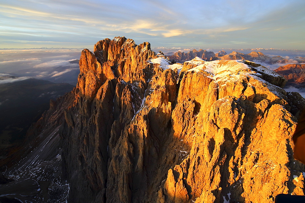 Aerial shot of Sassolungo and Sassopiatto at sunset, Sella Group, Val Gardena, Dolomites, Val Funes, Trentino-Alto Adige South Tyrol, Italy, Europe