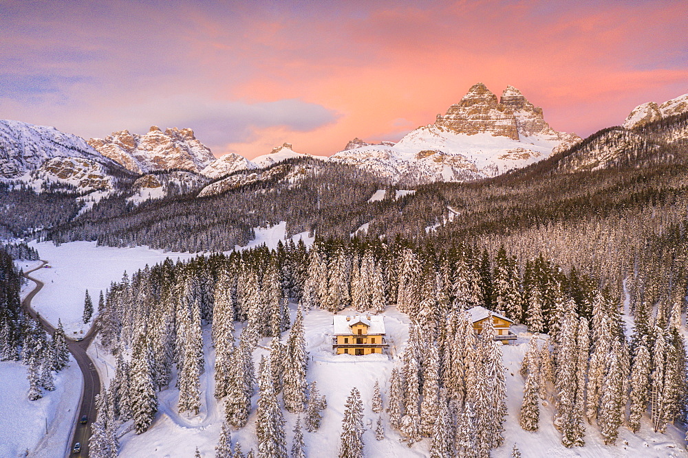 Tre Cime di Lavaredo and woods covered with snow during a winter sunset, Misurina, Dolomites, Belluno province, Veneto, Italy, Europe