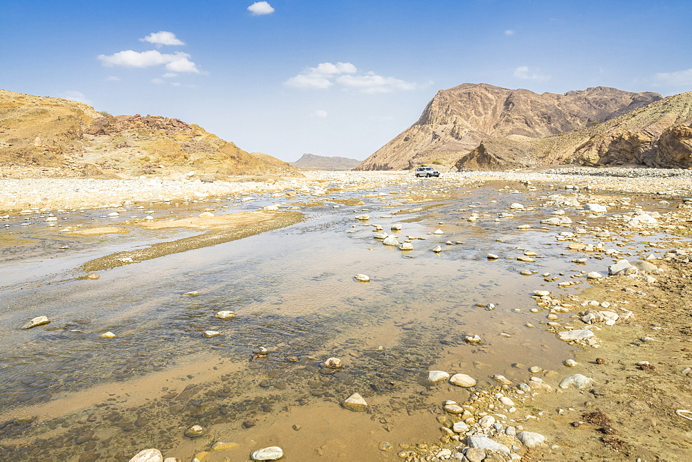 Jeep traveling along the course of Saba river and canyon, Dallol, Danakil Depression, Afar Region, Ethiopia, Africa