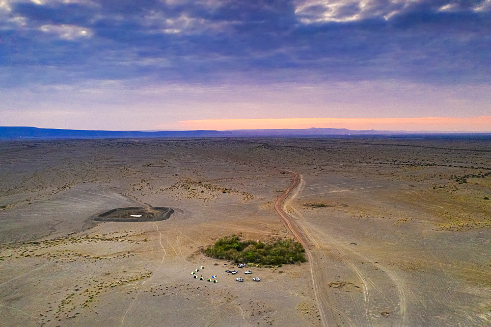 Aerial view by drone of jeeps and camping tents in the desert, Semera, Afar Region, Ethiopia, Africa