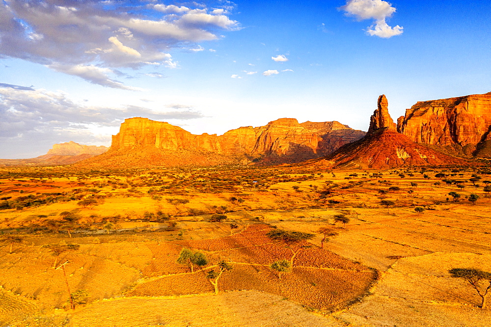 Sunset lit the red rocks of Gheralta Mountains, aerial view by drone, Hawzen, Tigray Region, Ethiopia, Africa