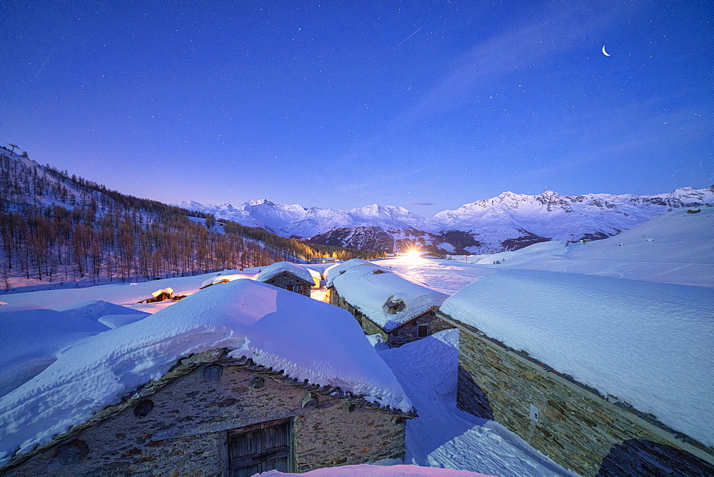 Groppera stone huts covered with snow during a starry night, Madesimo, Valchiavenna, Valtellina, Lombardy, Italy, Europe