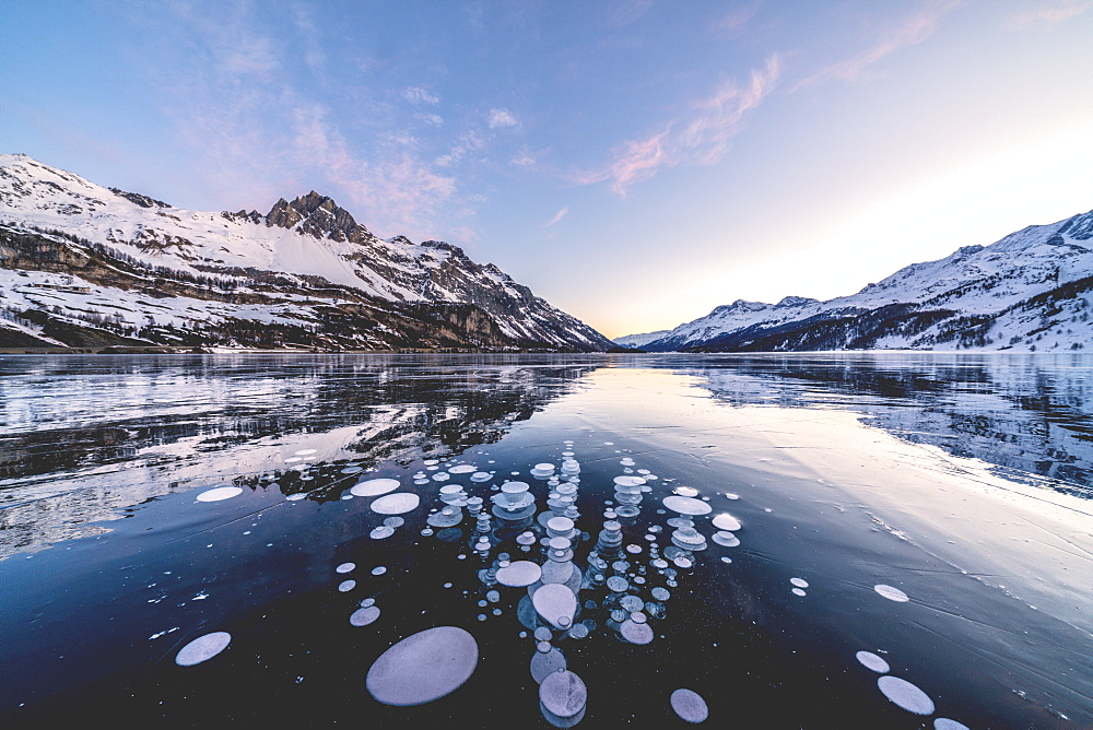 Ice bubbles trapped in Lake Sils with Piz Lagrev in background, Engadine, canton of Graubunden, Switzerland, Europe