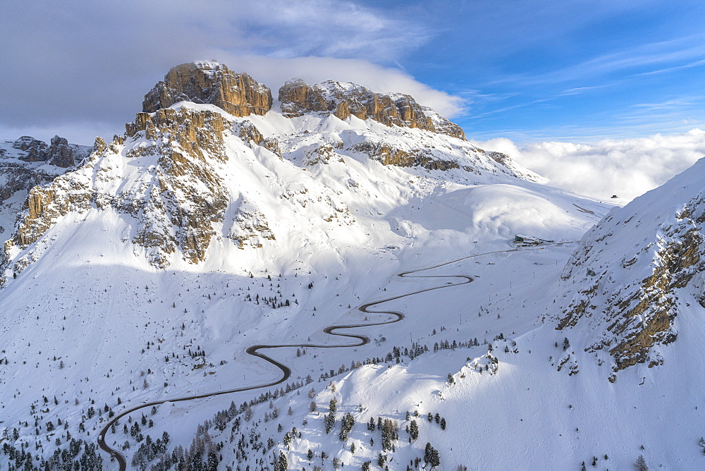 Winding road in the snow, aerial view, Pordoi Pass, Dolomites, Trentino-Alto Adige, Italy, Europe