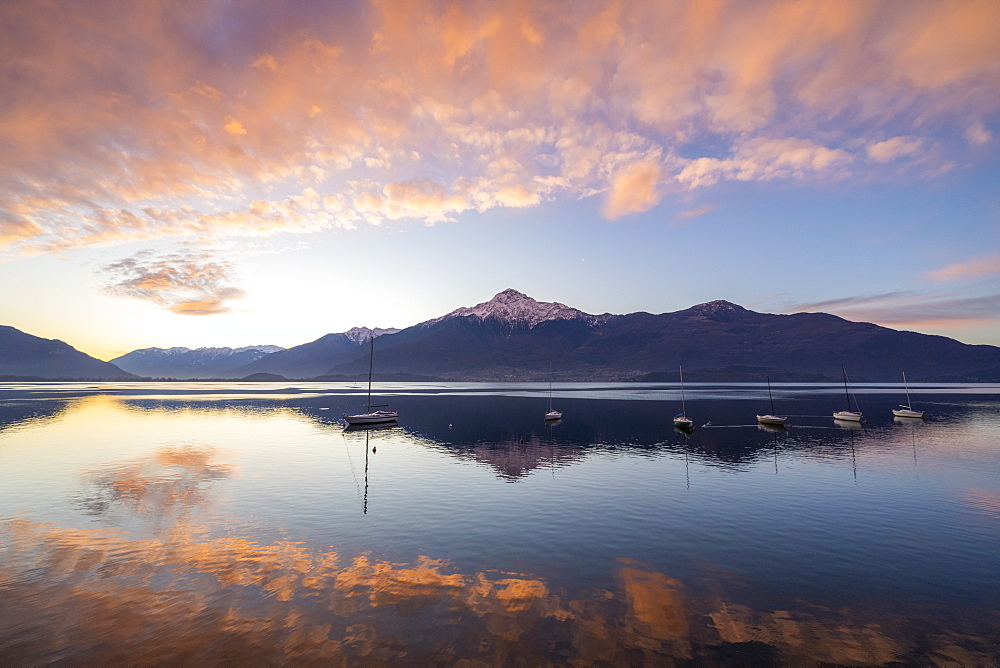 Clouds at sunrise mirrored in Lake Como, Domaso, Lombardy, Italian Lakes, Italy, Europe