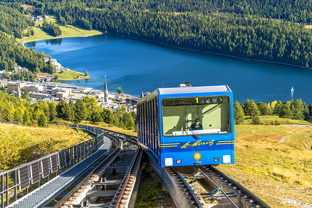 Funicular car uphill with St. Moritz lake and village in the background, Engadine, canton of Graubunden, Switzerland, Europe