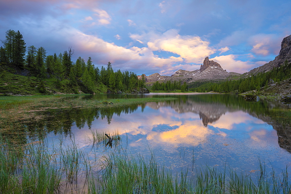 Pristine alpine Lake Federa and Becco di Mezzodi mountain lit by sunset, Ampezzo Dolomites, Belluno province, Veneto, Italy, Europe