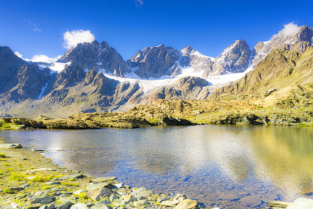 Clear sky over the rocky peaks of Bernina Group and Forbici lake in summer, Valmalenco, Valtellina, Lombardy, Italy, Europe