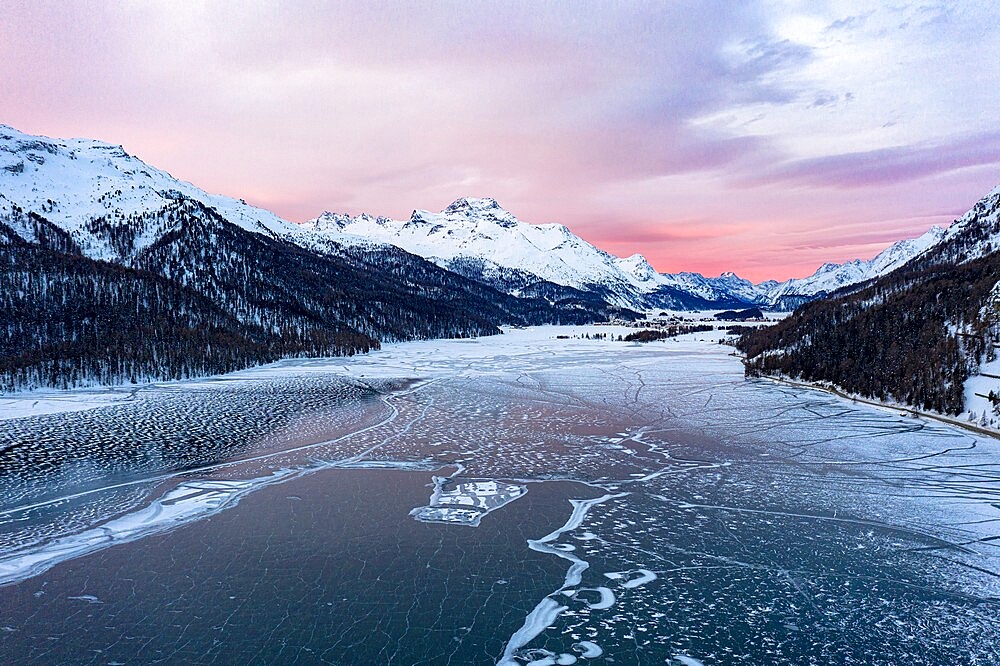 Sunrise on the snowcapped mountains and frozen Lake Silvaplana, aerial view, Maloja, Engadine, Graubunden canton, Switzerland, Europe