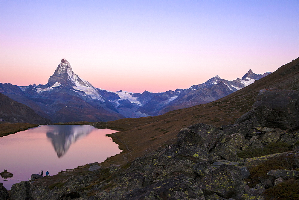 Pink sky at sunrise on the Matterhorn reflected in Stellisee, Zermatt, Canton of Valais, Pennine Alps, Swiss Alps, Switzerland, Europe