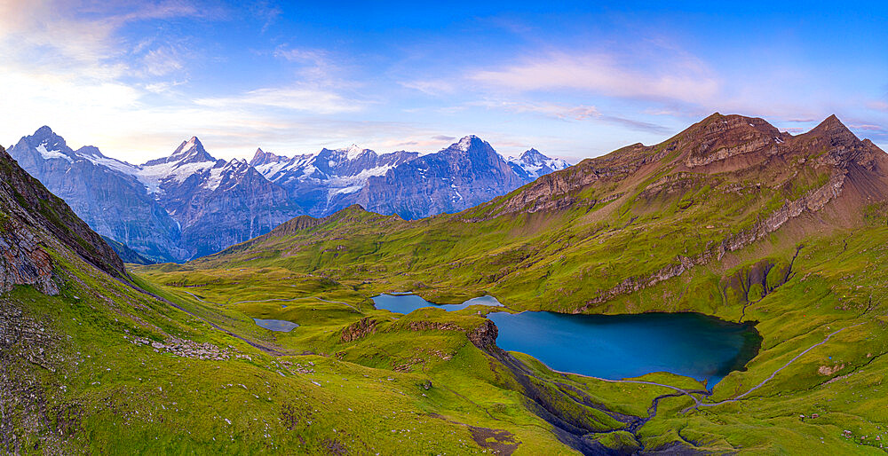 Sunrise over Wetterhorn, Schreckhorn and Finsteraarhorn from Bachalpsee lake, Grindelwald, Bernese Oberland, Switzerland, Europe