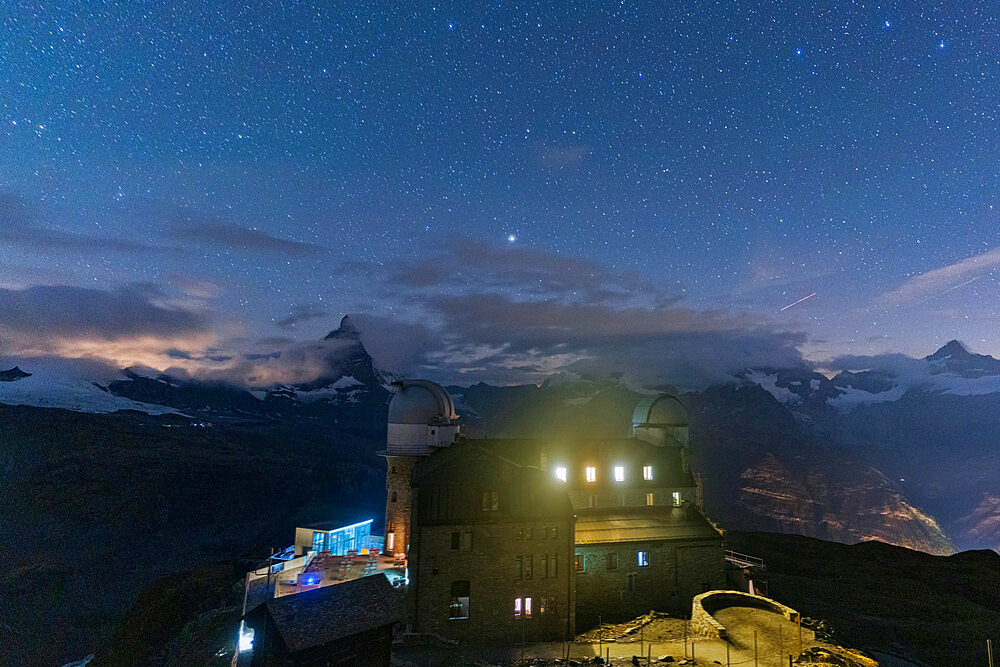 Starry sky over the Kulmhotel Gornergrat and Matterhorn, Zermatt, canton of Valais, Switzerland, Europe