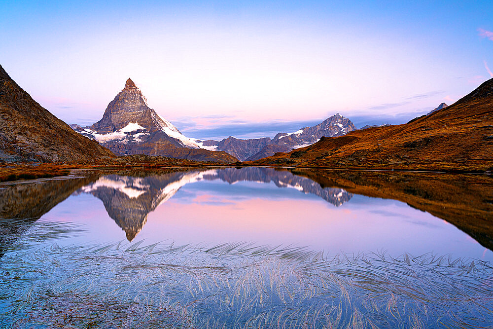 Matterhorn reflected in Riffelsee lake at dawn, Gornergrat, Zermatt, canton of Valais, Switzerland, Europe