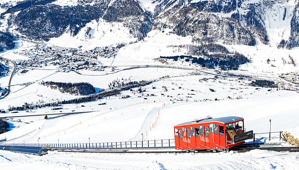 Tourists enjoying the journey on funicular in the snowy landscape, Muottas Muragl, Samedan, Engadine, Graubunden, Switzerland, Europe