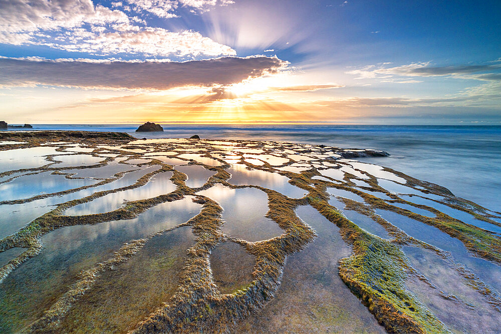 Natural pools and rocks in the surreal beach of El Cotillo lit by sunset, Fuerteventura, Canary Islands, Spain, Atlantic, Europe