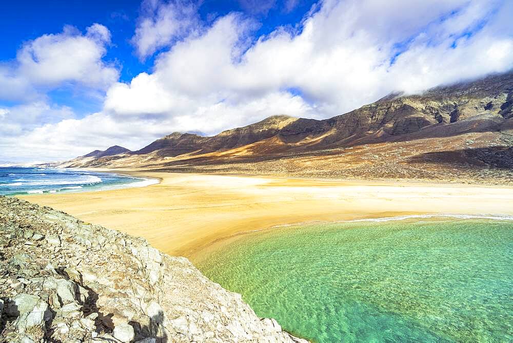 Both sides of crystal ocean viewed from El Islote islet, Cofete beach, Jandia peninsula, Fuerteventura, Canary Islands, Spain, Atlantic, Europe