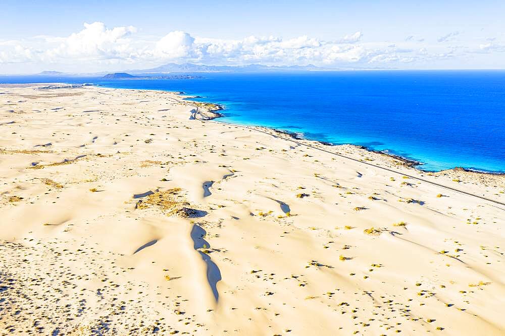 White sand dunes meeting the blue Atlantic Ocean, aerial view, Corralejo Nature Park, Fuerteventura, Canary Islands, Spain, Atlantic, Europe