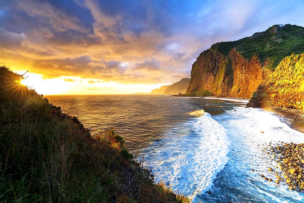 Scenic sky at dawn over waves crashing on cliffs, Madeira island, Portugal, Atlantic, Europe