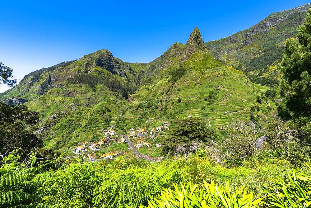 Village of Serra de Agua in the lush vegetation at feet of mountains, Ribeira Brava municipality, Madeira island, Portugal, Atlantic, Europe