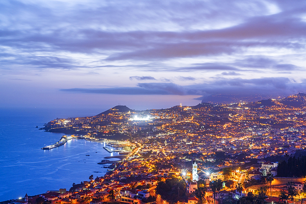 Dusk over the iIluminated city of Funchal viewed from Sao Goncalo, Madeira island, Portugal, Atlantic, Europe