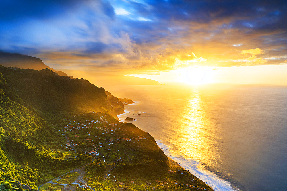 Clouds over Arco de Sao Jorge and Ponta Delgada lit by the warm sunset, Atlantic Ocean, Madeira island, Portugal, Europe