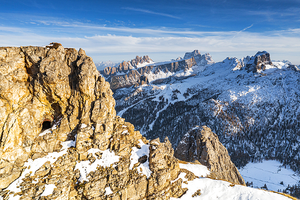 First World War rock tunnels on Mount Lagazuoi with Pelmo and Nuvolau peaks on background, aerial view, Natural Park of the Ampezzo Dolomites, Veneto, Italy, Europe