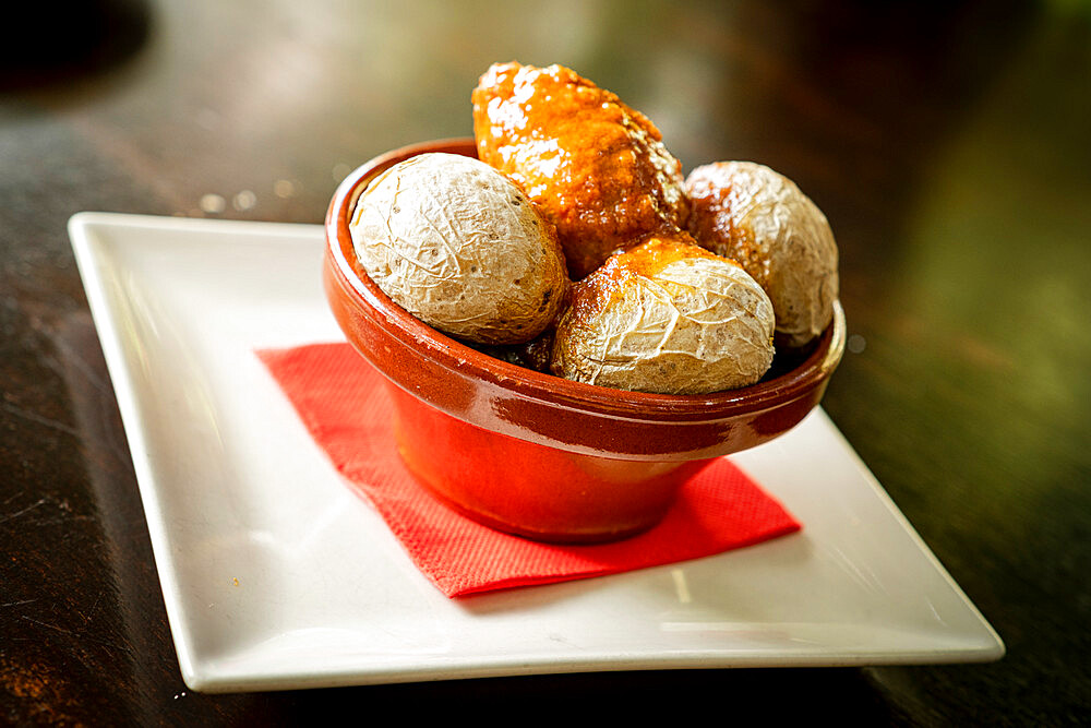 Typical wrinkled potatoes with spicy sauce in a bowl (Papas Arrugadas con Mojo Picon), Fuerteventura, Canary Islands, Spain, Europe