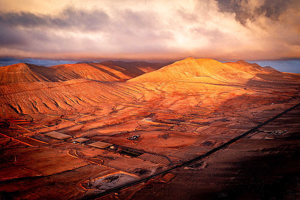 Aerial view of sunrise over the dry desert land of Caldereta, Vallebron, La Oliva, Fuerteventura, Canary Islands, Spain, Atlantic, Europe