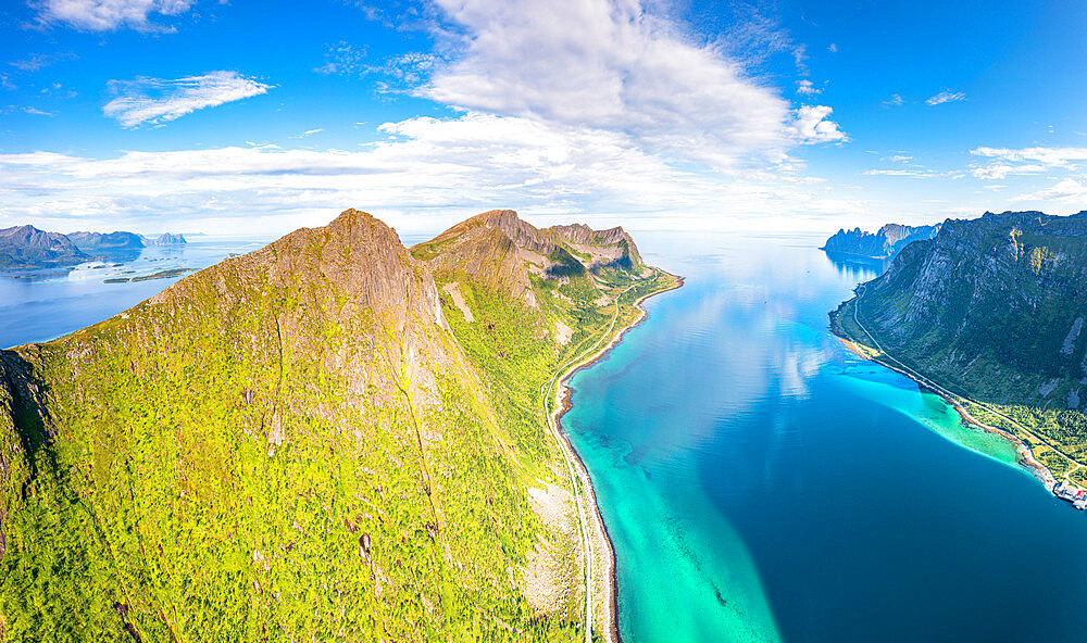 Aerial view of Husfjellet mountain peak overlooking the emerald green water of Steinfjord fjord, Senja, Troms county, Norway, Scandinavia, Europe