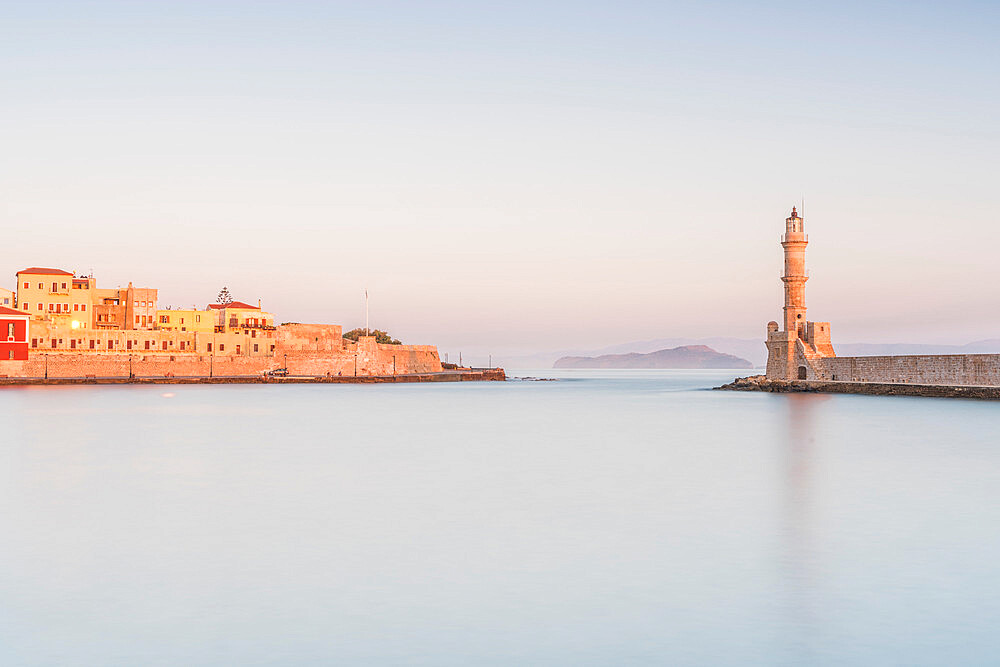 Romantic sky at dawn over the old fortress and lighthouse, Chania, Crete, Greek Islands, Greece, Europe