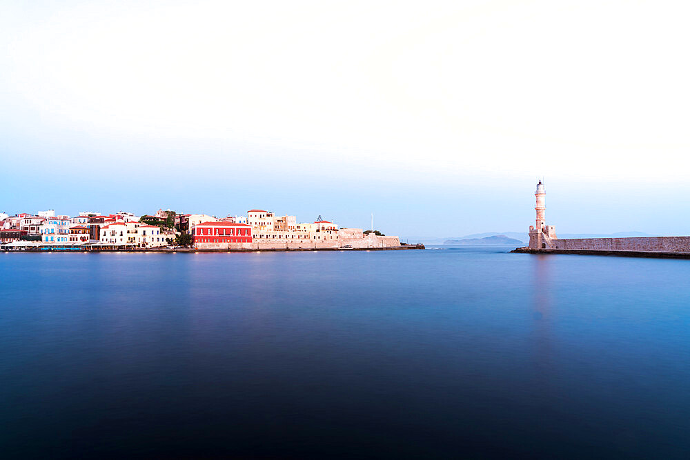 Dusk over the Venetian lighthouse and harbour of Chania old town, Crete, Greek Islands, Greece, Europe