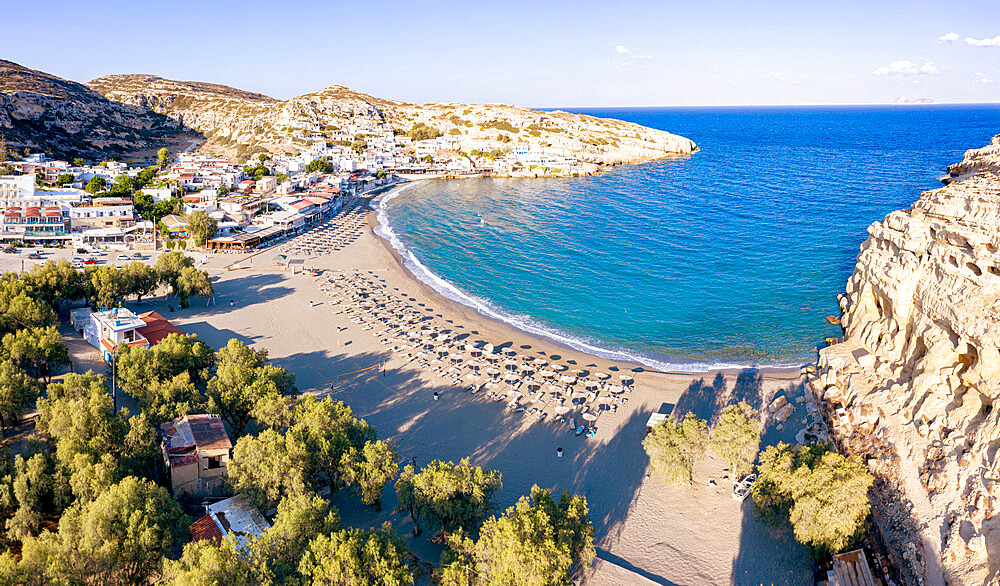 Sunrise over the empty beach of Matala seaside resort town, Crete, Greek Islands, Greece, Europe