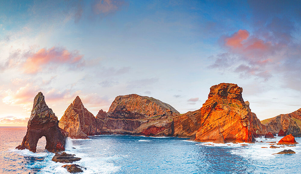 Natural arch, stone rocks and cliffs at dawn from Ponta do Rosto viewpoint, Sao Lourenco Peninsula, Madeira island, Portugal, Atlantic, Europe