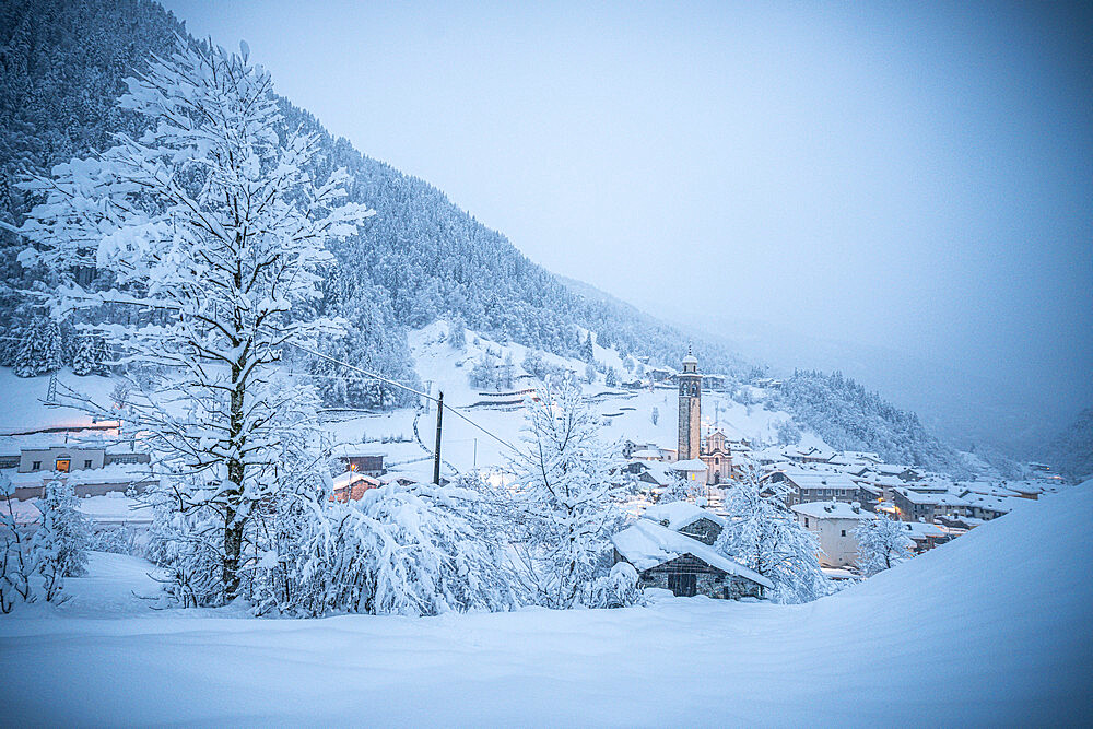 Alpine village in a white winter landscape after snowfall, Gerola Alta, Valgerola, Valtellina, Lombardy, Italy, Europe