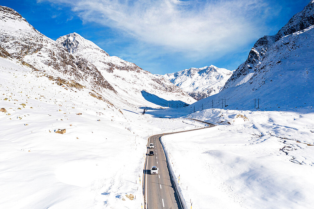 Aerial view of cars driving on mountain road in winter, Julier Pass, Albula district, Engadine, canton of Graubunden, Switzerland, Europe