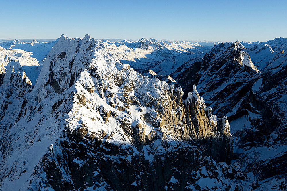 Aerial view of rock pinnacles of majestic Sciora di Dentro mountain, Val Bregaglia, Graubunden Canton, Switzerland, Europe