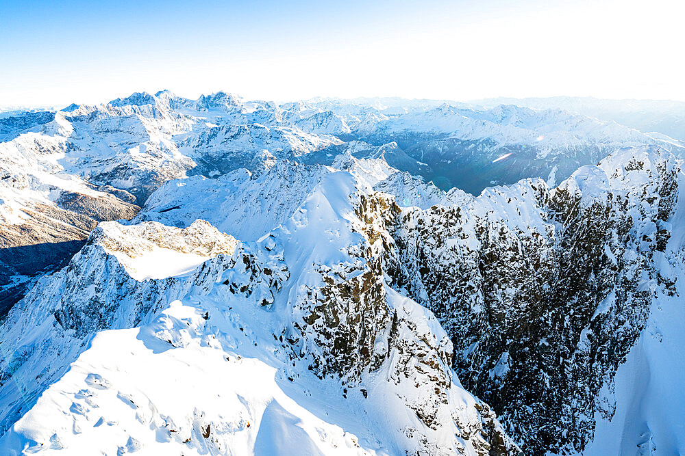 Winter sunrise on the snowcapped Monte Disgrazia, aerial view, Valmalenco, Sondrio province, Valtellina, Lombardy, Italy, Europe