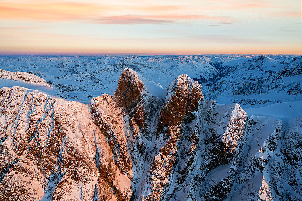 Aerial view of snowy Punte della Sella peaks during a winter sunrise, Valmalenco, Valtellina, Sondrio province, Lombardy, Italy, Europe