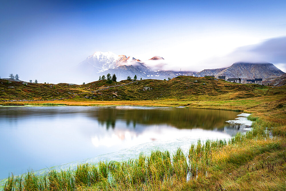 Mist on Fletschhorn and Galehorn mountains reflected in Hopschusee lake at dawn, Simplon Pass, Valais Canton, Swiss Alps, Switzerland, Europe